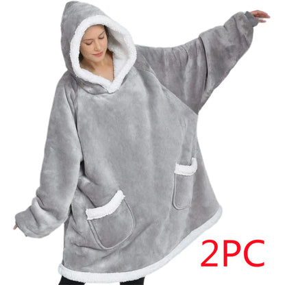Gray hooded poncho with white trim worn by a person on a white background, with '2PC' text in red.