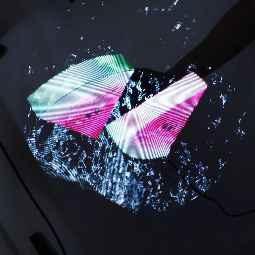 Digital display of watermelon slices on a dark background