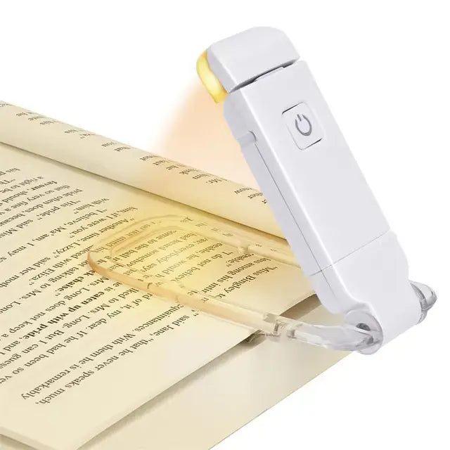 Reading lamp on an open book with text
