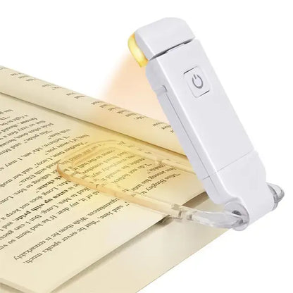 Reading lamp on an open book with text