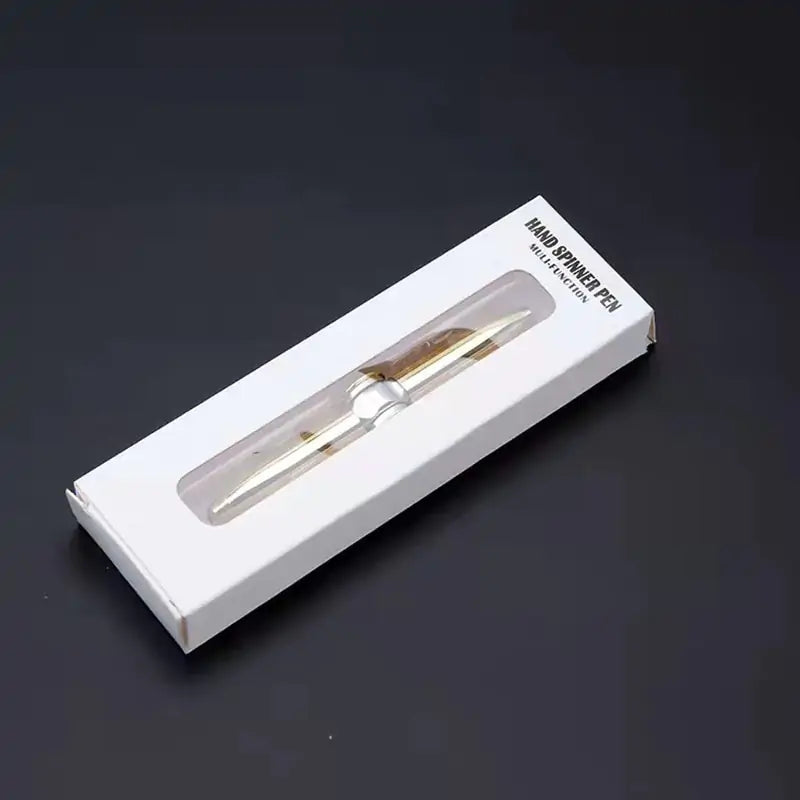 Gold pen in a white box on a dark background