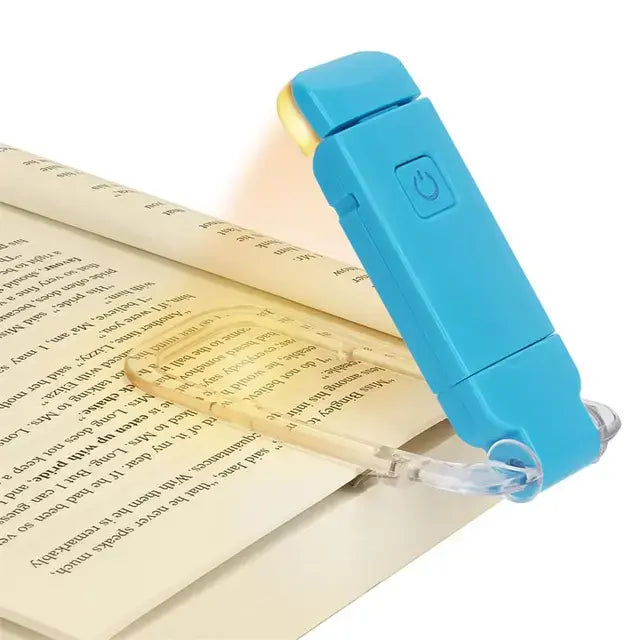 Blue booklight illuminating a page of a book on a white background