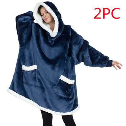 Blue fleece poncho with white trim worn by a person on a white background, with '2PC' text in red.