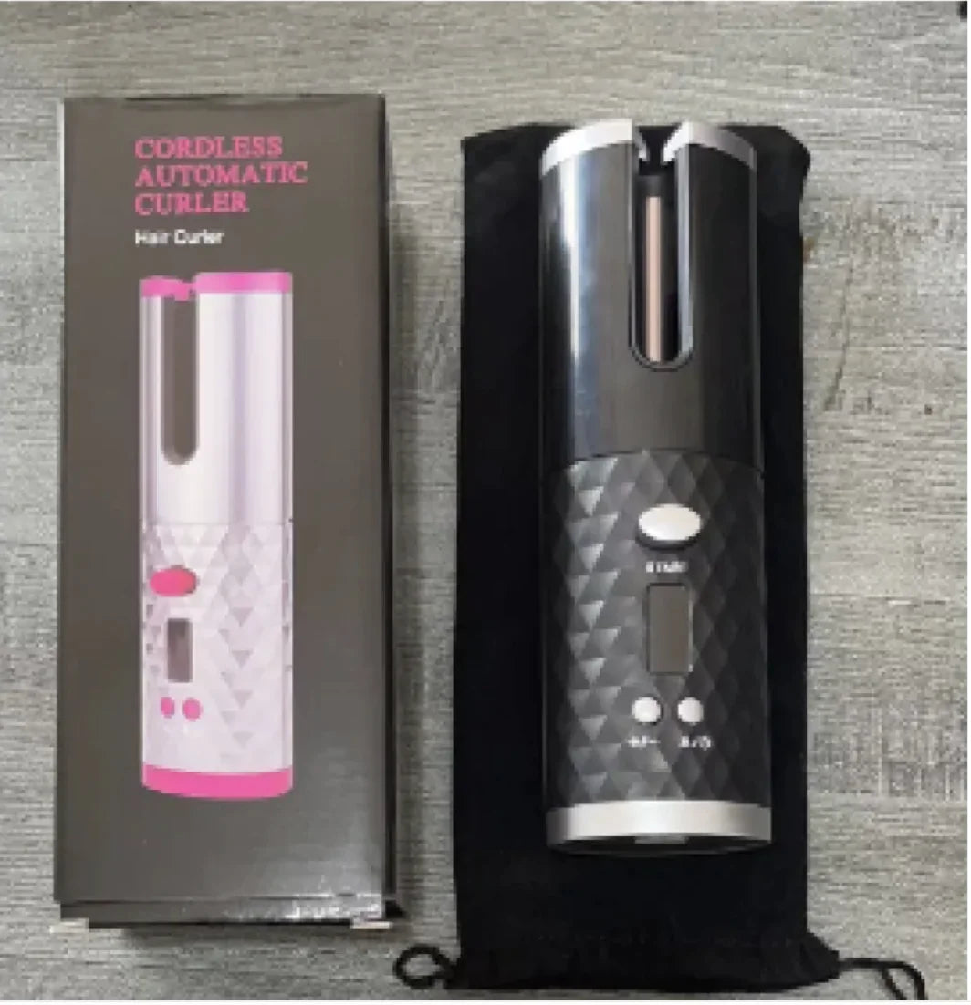 Cordless automatic hair curler with packaging on a gray textured background